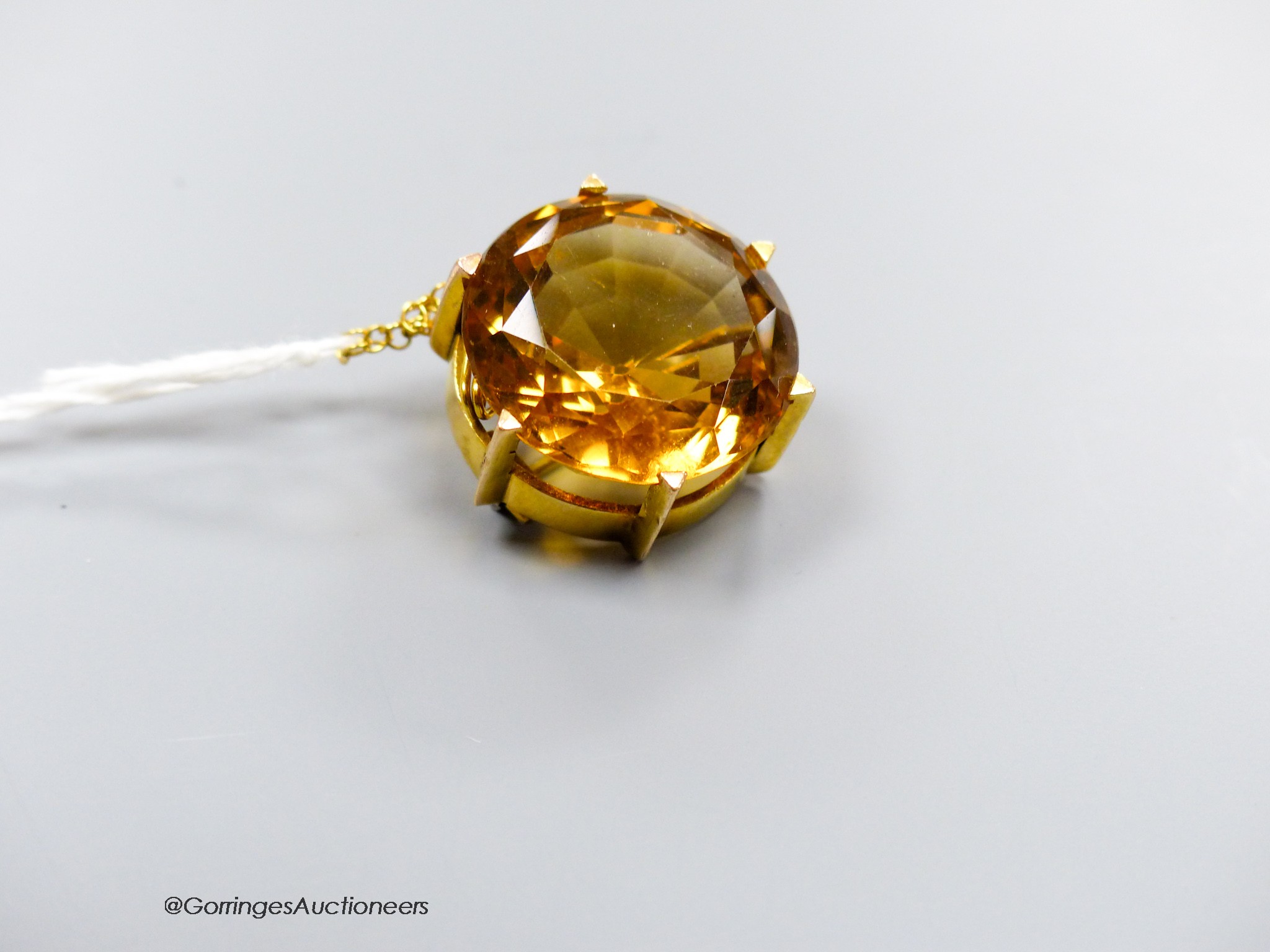 A yellow metal mounted citrine brooch, 20mm, gross 11.8 grams.